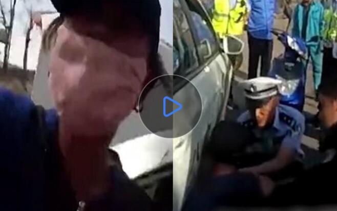 兒子無證駕駛被傳喚 母親打罵交警將腿伸入車下阻止